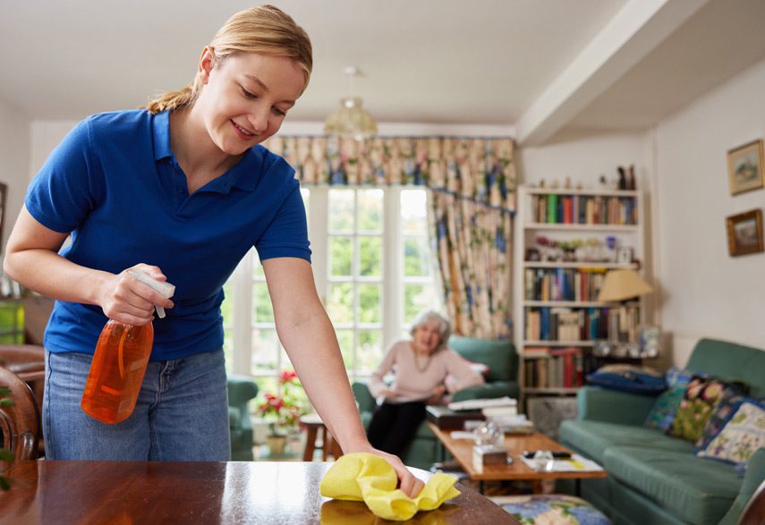 Home-health-aide-doing-household-chores