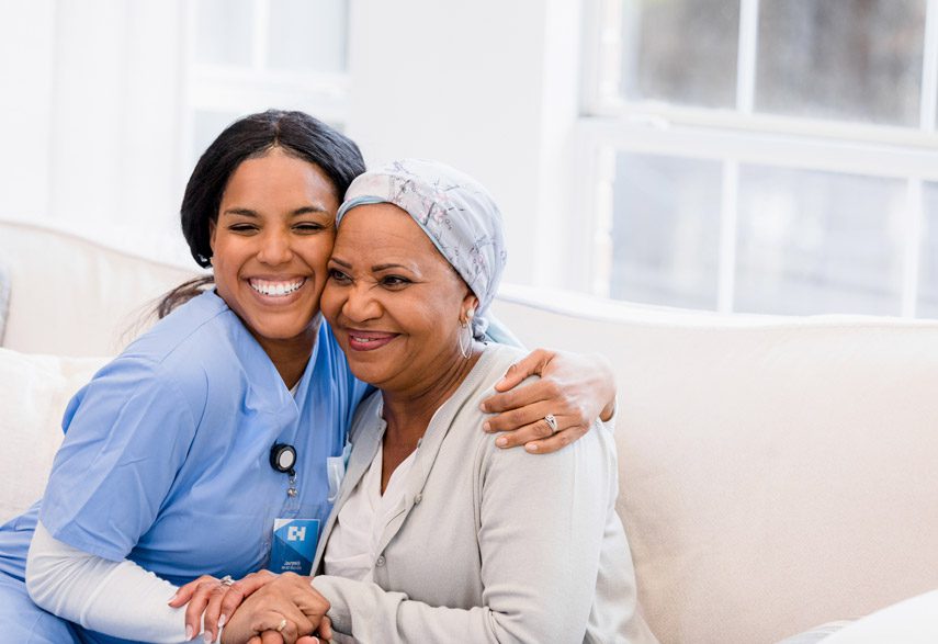 Hospice-nurse-embracing-patient