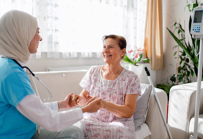 hospice-nurse-holding-patient's-hands